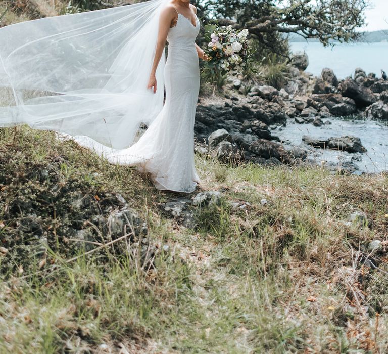 Bride in Estelle Sally Eagle Gown | Outdoor Coastal Wedding at Ohawini Bay in New Zealand with Natural Garden Party Reception | Miss Gen Photography