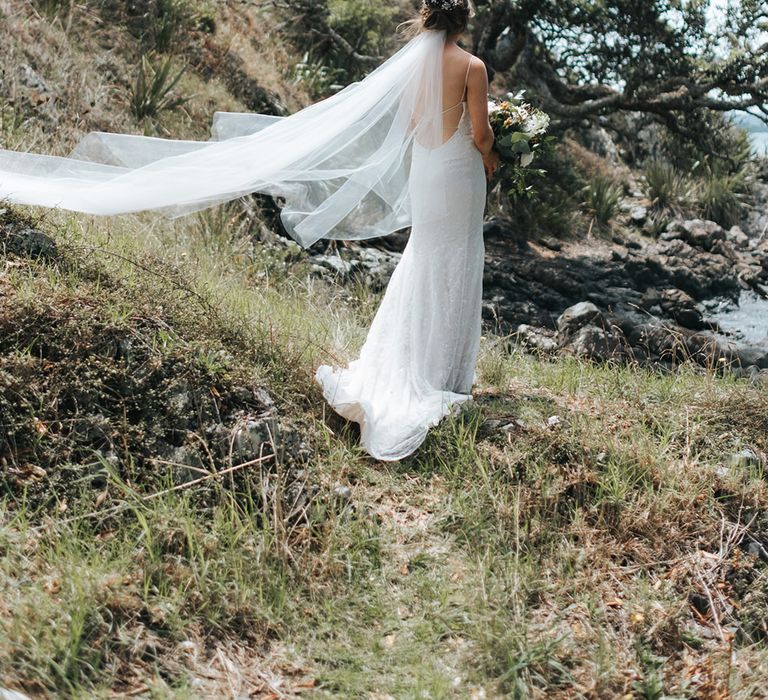 Bride in Estelle Sally Eagle Gown | Outdoor Coastal Wedding at Ohawini Bay in New Zealand with Natural Garden Party Reception | Miss Gen Photography