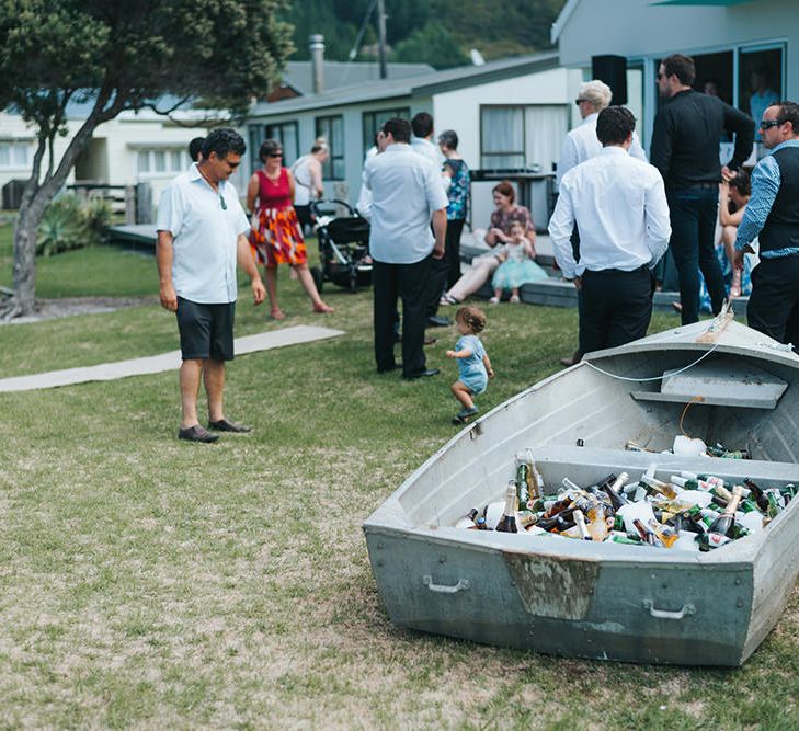 Beer Boat | Outdoor Coastal Wedding at Ohawini Bay in New Zealand with Natural Garden Party Reception | Miss Gen Photography