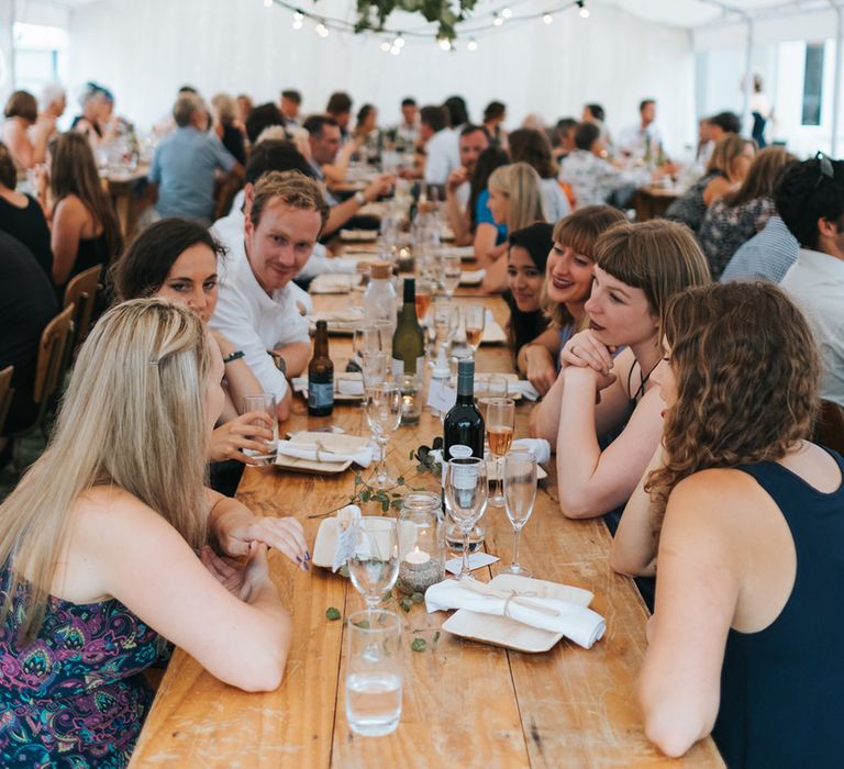 Marquee Reception with Wood, Greenery & Festoon Light Decor | Outdoor Coastal Wedding at Ohawini Bay in New Zealand with Natural Garden Party Reception | Miss Gen Photography