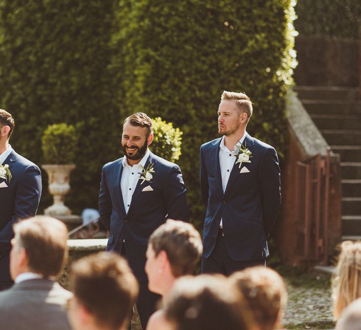 Wedding Ceremony | Groomsmen in Navy Peter Jackson Suits | Outdoor Destination Wedding at Villa Regina Teodolinda, Lake Como, Italy | Matt Penberthy Photography