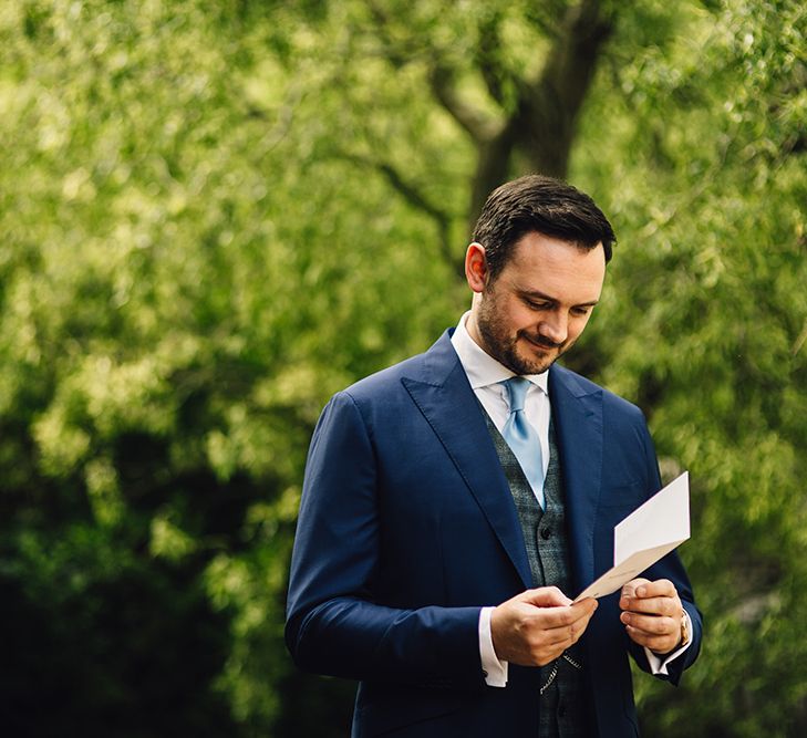 Groom in Navy Suit Supply Suit