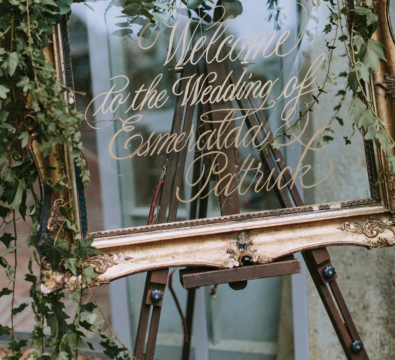 Gold Guilt Mirror Wedding Sign Decorated with Flowers