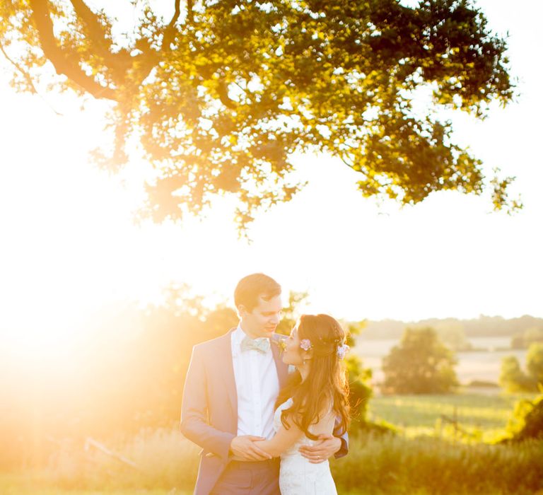 Bride in Pronovias Gown & Groom Navy in Kin by John Lewis Suit Sunset Moment