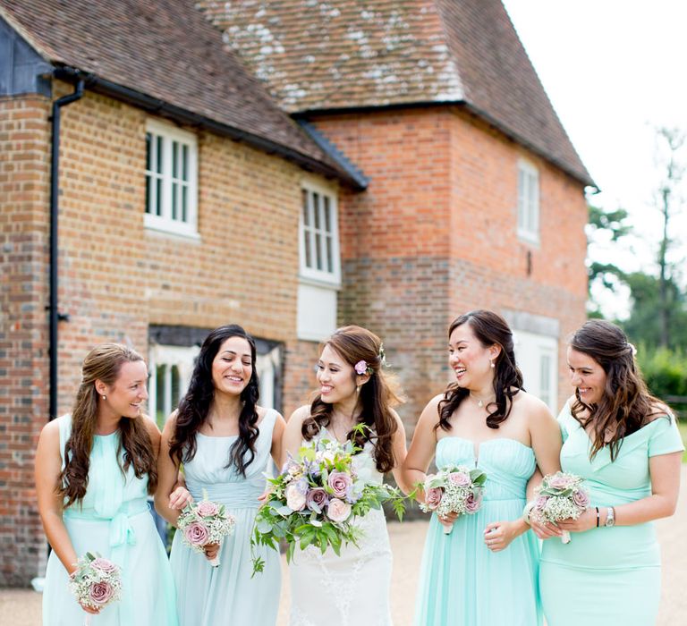 Bride in Pronovias Gown and Bridesmaids in Mis-Match Aqua Dresses