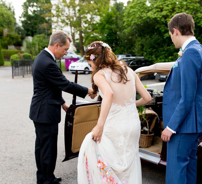 Bride in Pronovias Gown & Groom Navy in Kin by John Lewis Suit Confetti Moment