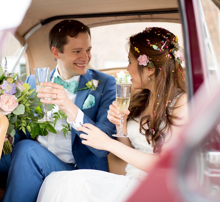 Bride in Pronovias Gown & Groom Navy in Kin by John Lewis Suit