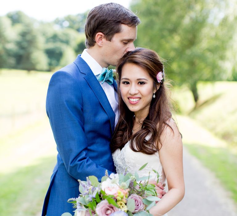 Bride in Pronovias Gown & Groom Navy in Kin by John Lewis Suit