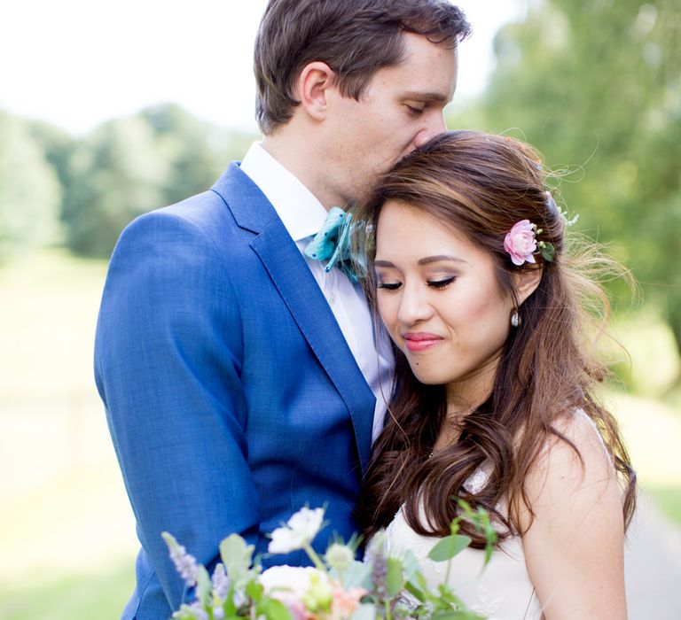 Bride in Pronovias Gown & Groom Navy in Kin by John Lewis Suit