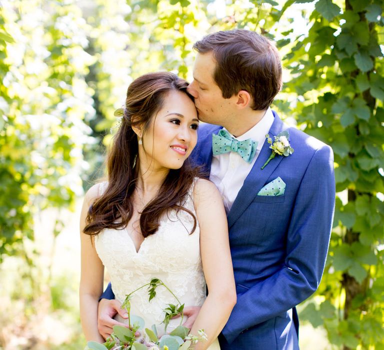 Bride in Pronovias Gown & Groom Navy in Kin by John Lewis Suit