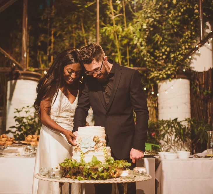 Bride & Groom Cutting the Cake