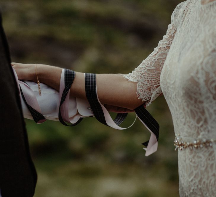 Hand Fastening | Wedding Ceremony | Bride in Sarah Seven Lace Wedding Dress | Groom in Walker Slater | Isle of Sky Elopement Wedding | Wonderful & Strange Photography