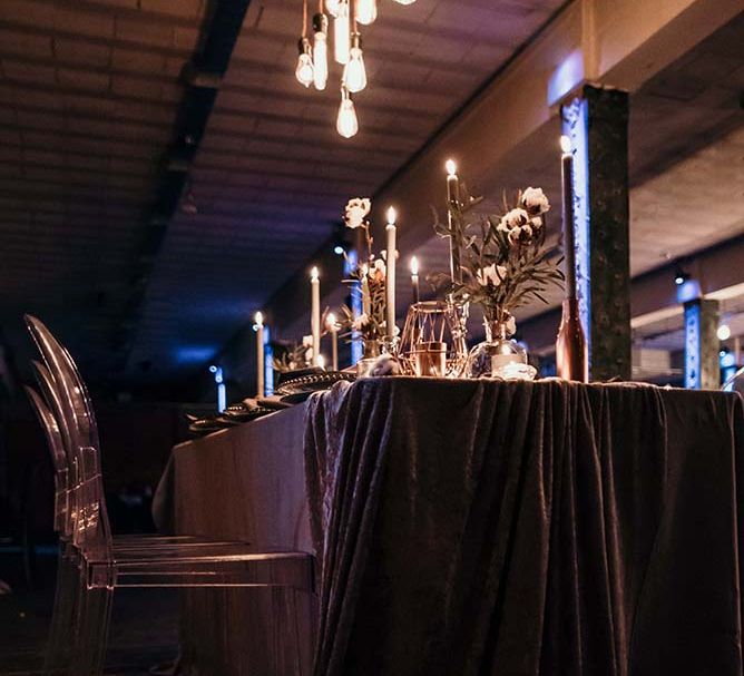 Candle Light Table Scape with Ghost Chairs & Glass Platters | Edison Lights | Industrial Wedding Inspiration at Victoria Warehouse in Manchester | Planning & Styling by The Urban Wedding Company | 2 Ducks Galleries