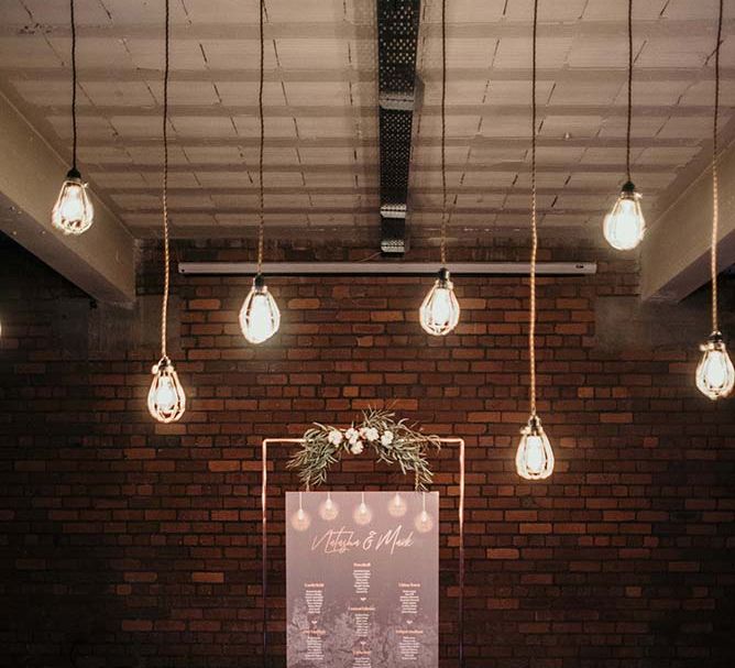 Gold Foil Table Plan & Edison Lights | Industrial Wedding Inspiration at Victoria Warehouse in Manchester | Planning & Styling by The Urban Wedding Company | 2 Ducks Galleries