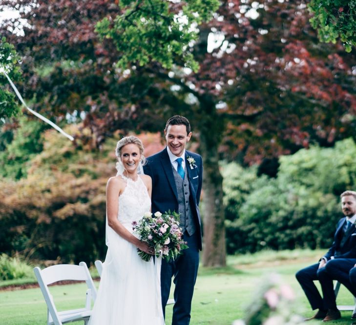 Outdoor Wedding Ceremony | Bride in Watters Peyton Top & Gracia Skirt Bridal Separates | Groom in Next Suit | Rustic Wedding at Patricks Barn, Sussex | Dale Weeks Photography | Love Filmed