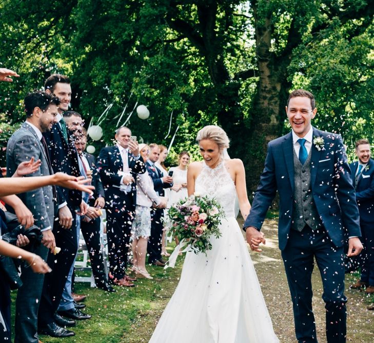 Confetti Moment | Bride in Watters Peyton Top & Gracia Skirt Bridal Separates | Groom in Next Suit | Outdoor Ceremony & Rustic Wedding at Patricks Barn, Sussex | Dale Weeks Photography | Love Filmed