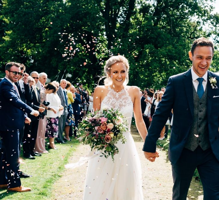 Confetti Moment | Bride in Watters Peyton Top & Gracia Skirt Bridal Separates | Groom in Next Suit | Outdoor Ceremony & Rustic Wedding at Patricks Barn, Sussex | Dale Weeks Photography | Love Filmed