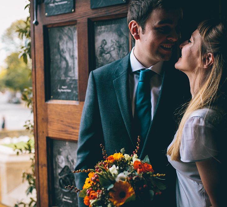 Bride in Ghost Dress, Fur Jacket & Autumnal Bouquet