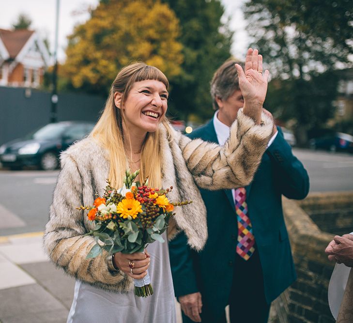 Bride in Ghost Dress, Fur Jacket & Autumnal Bouquet