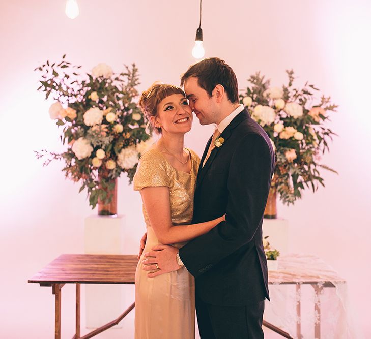 Bride in Bespoke Gold Gown & Groom in Moss Bros Hire Suit