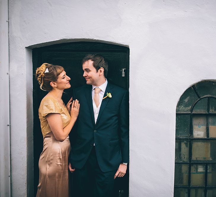 Bride in Bespoke Gold Gown & Groom in Moss Bros Hire Suit