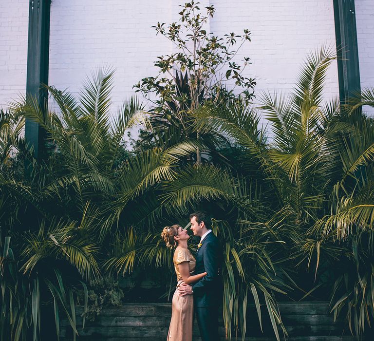 Bride in Bespoke Gold Gown & Groom in Moss Bros Hire Suit