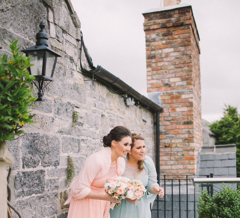 Bridesmaids in Pastel Peach & Green Gowns