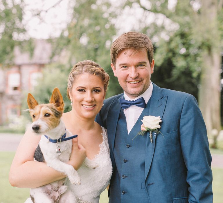 Bride in Modeca Wedding Dress & Groom in Navy Three Piece Suit