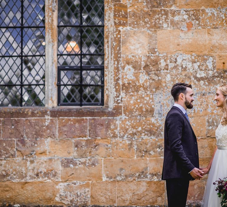 Bride in Catherine Deane Carly Bridal Gown | Groom in Navy Suit | Bright At Home Tipi Wedding | Barney Walters Photography