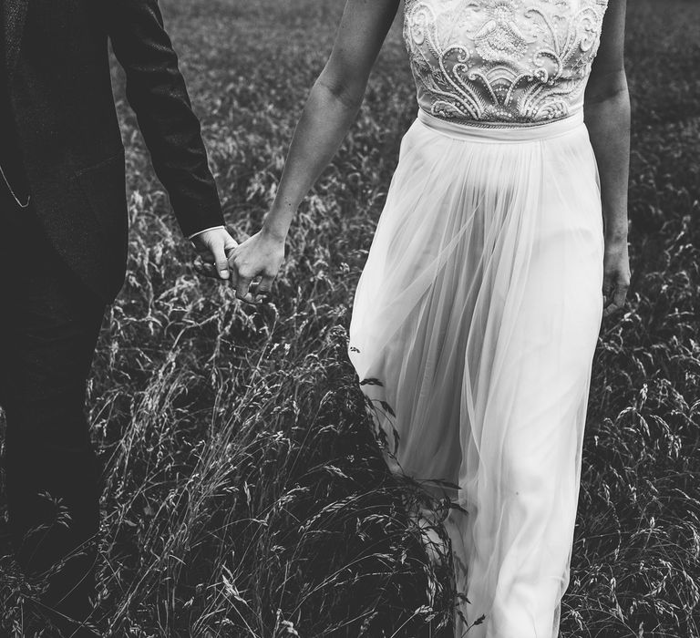 Bride in Catherine Deane Carly Bridal Gown | Groom in Navy Suit | Bright At Home Tipi Wedding | Barney Walters Photography