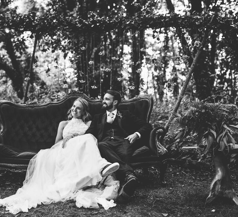 Bride in Catherine Deane Carly Bridal Gown | Groom in Navy Suit | Bright At Home Tipi Wedding | Barney Walters Photography