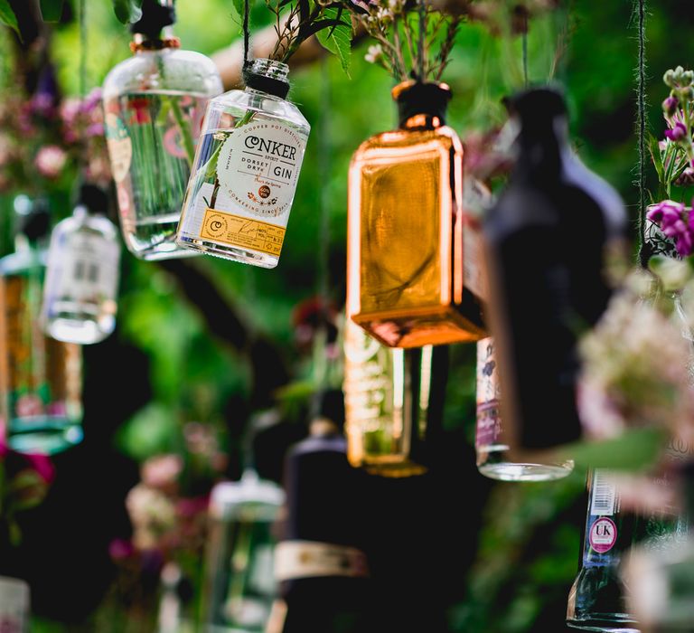 DIY Hanging Gin Bottles Wedding Decor | Bright At Home Tipi Wedding | Barney Walters Photography