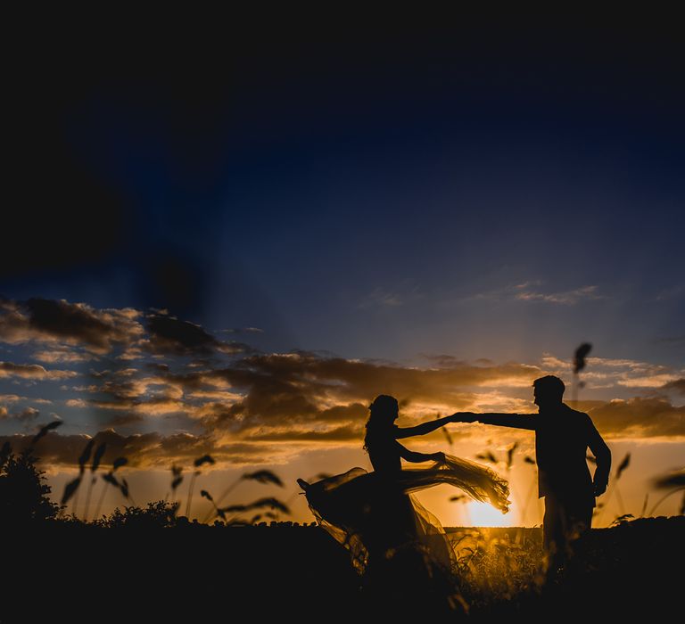 Sunset | Bride in Catherine Deane Carly Bridal Gown | Groom in Navy Suit | Bright At Home Tipi Wedding | Barney Walters Photography