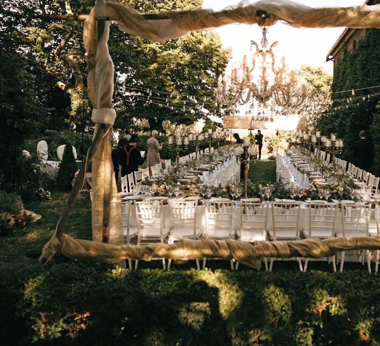 Romantic Outdoor Destination Wedding Umbria With White Linen, Foliage And Gold Accents With Bride In Bespoke Lace Dress And Images From Andrea & Federica