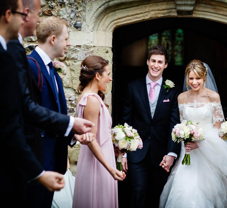 Confetti Exit | Bride in Sassi Holford Grace Wedding Dress | Groom in Traditional Oliver Brown Tailored Suit | Blink Photography