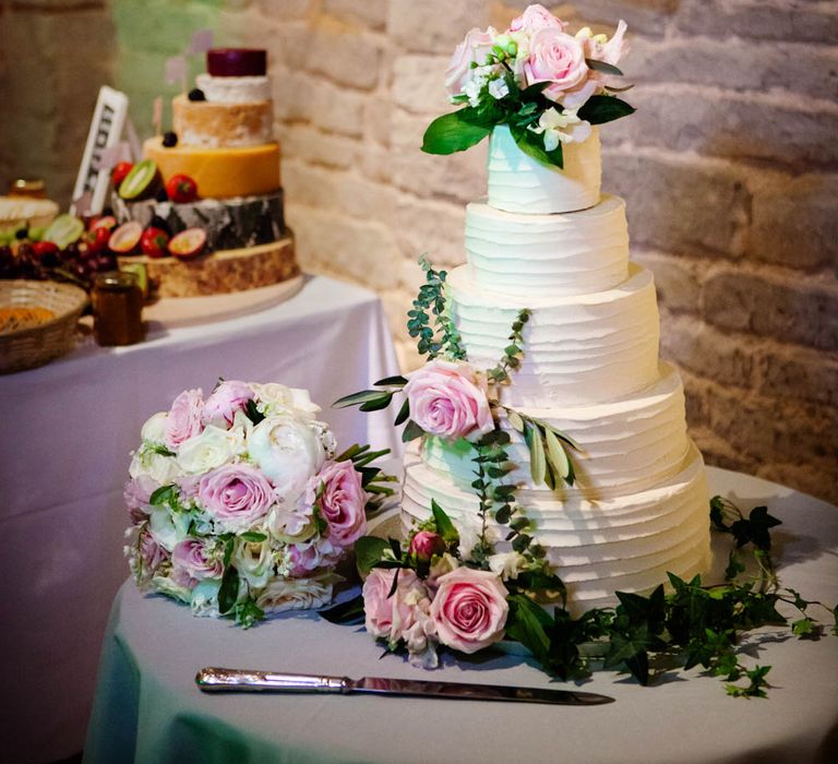 Frosting Wedding Cake | Classic Pink Wedding at The Tithe Barn in Hampshire | Blink Photography