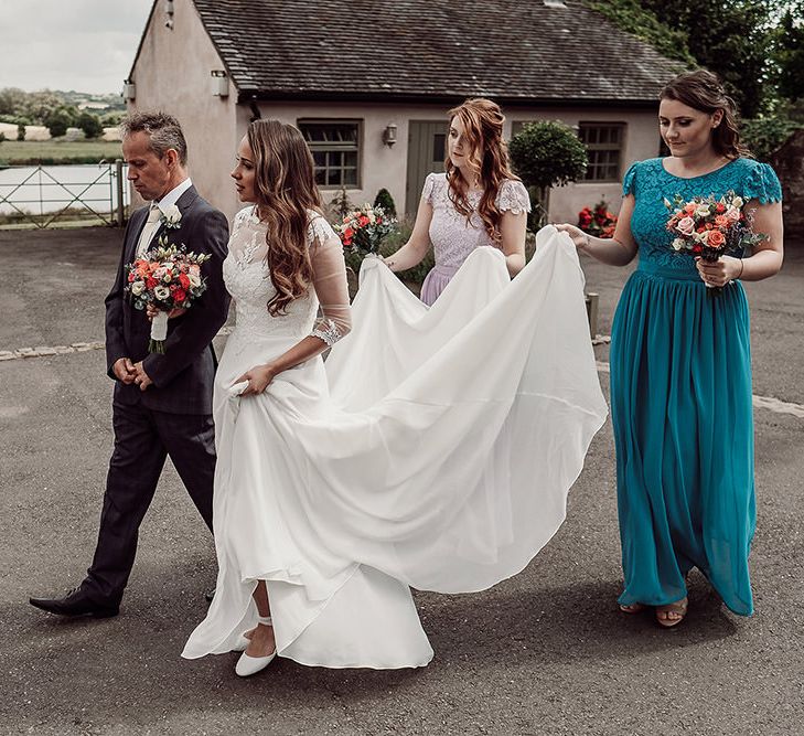 Bride in Justin Alexander and Bridesmaids in Different Coloured For Her and For Him Dresses