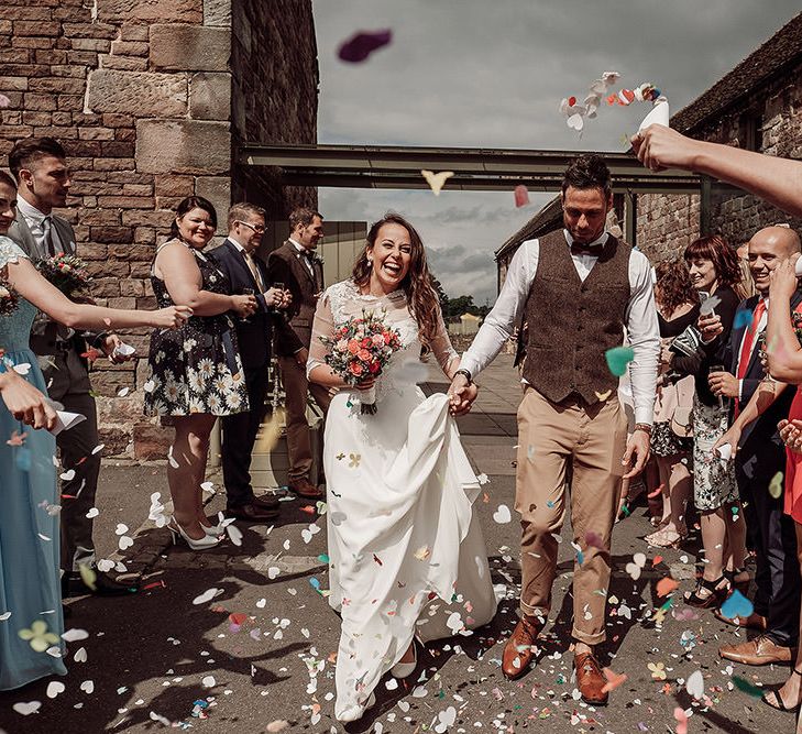 Bride in Justin Alexander and Groom in Chino's and Harris Tweed Confetti Moment