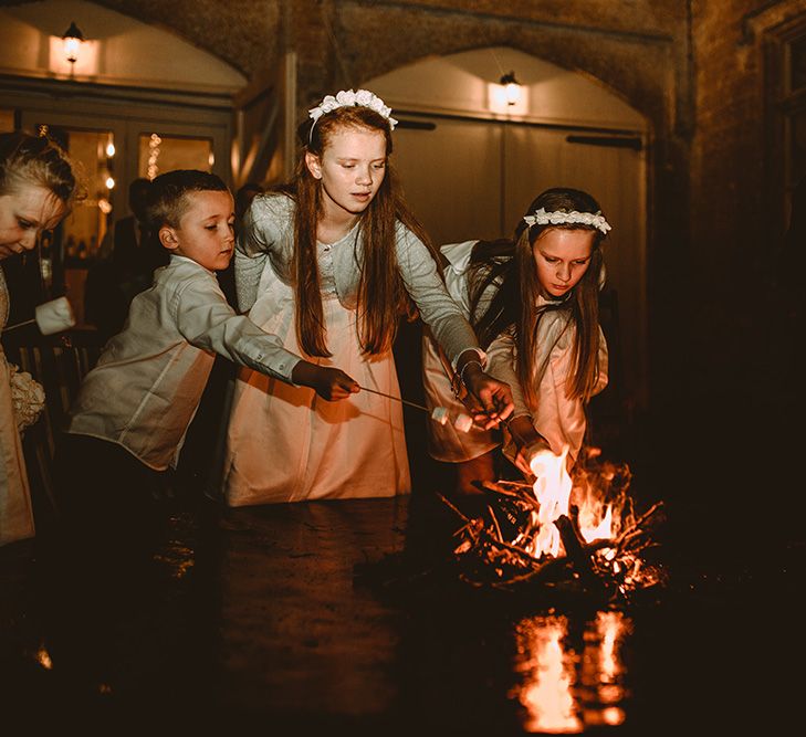 Fire Pit At Wedding // Elegant White Wedding In Somerset With Bride In Lace Long Sleeved Gown With Open Back And Loose Braid With Hair Vine Images From Carla Blain Photography