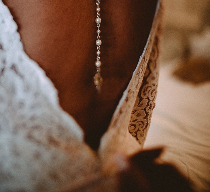 Back Necklace For Wedding Dress With Low Back // Elegant White Wedding In Somerset With Bride In Lace Long Sleeved Gown With Open Back And Loose Braid With Hair Vine Images From Carla Blain Photography