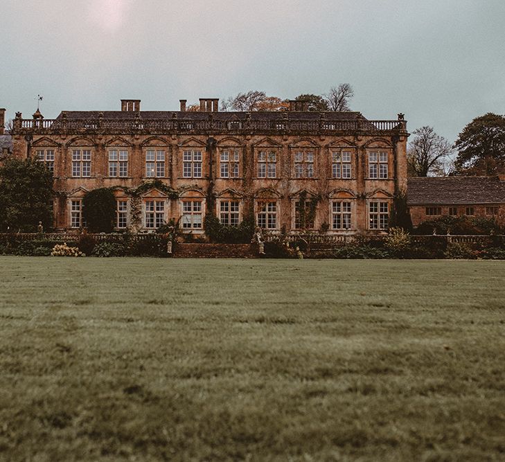 Elegant White Wedding In Somerset With Bride In Lace Long Sleeved Gown With Open Back And Loose Braid With Hair Vine Images From Carla Blain Photography