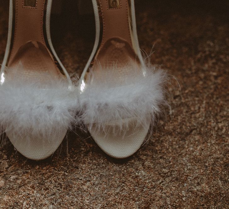 White Fluffy Bridal Shoes // Elegant White Wedding In Somerset With Bride In Lace Long Sleeved Gown With Open Back And Loose Braid With Hair Vine Images From Carla Blain Photography