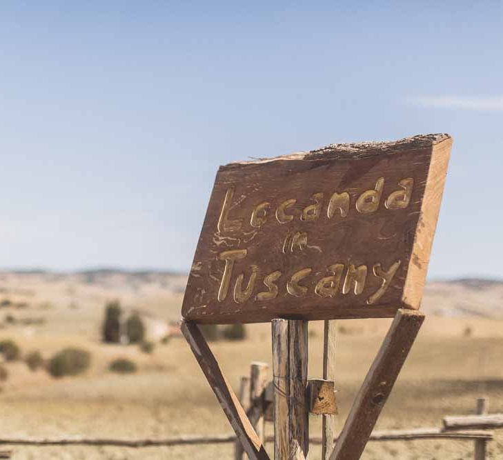 Wooden Welcome Sign For Wedding // Rustic Luxe Wedding In Tuscany Styled By The Wedding Of My Dreams With Flowers By Passion For Flowers Anna Campbell Bride Images & Film From WE ARE // THE CLARKES