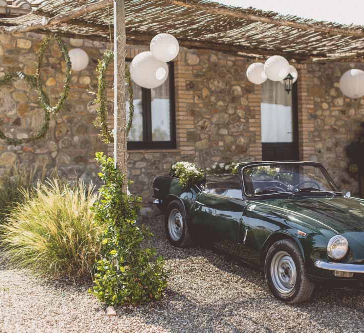 Vintage Wedding Car For Destination Wedding // Rustic Luxe Wedding In Tuscany Styled By The Wedding Of My Dreams With Flowers By Passion For Flowers Anna Campbell Bride Images & Film From WE ARE // THE CLARKES