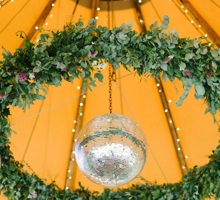 Tipi With Disco Ball & Foliage Chandelier Image by Hannah Duffy Photography