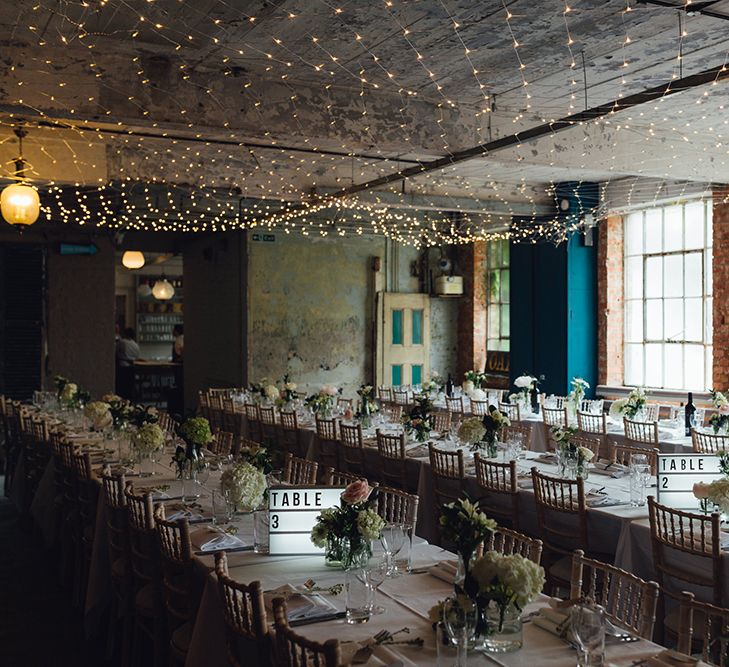 Relaxed Wedding Reception With Wooden Trestle Tables