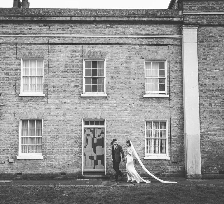 Bride in Story of My Dress Bridal Gown | Groom in Navy Suit from Tom James Tailors | Vintage Wedding at The Asylum & Town hall Hotel London | Kevin Fern Photography