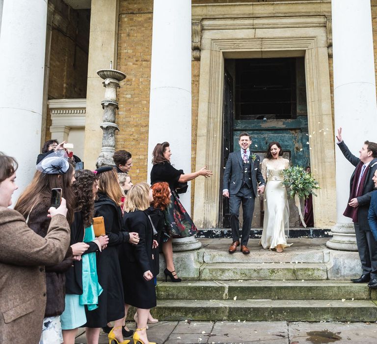 Bride in Story of My Dress Bridal Gown | Groom in Navy Suit from Tom James Tailors | Vintage Wedding at The Asylum & Town hall Hotel London | Kevin Fern Photography