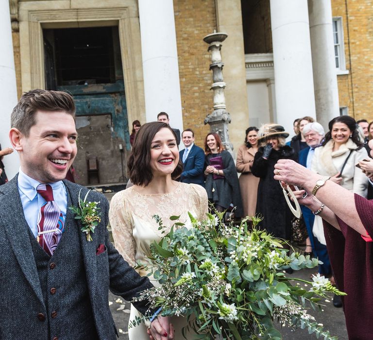 Bride in Story of My Dress Bridal Gown | Groom in Navy Suit from Tom James Tailors | Vintage Wedding at The Asylum & Town hall Hotel London | Kevin Fern Photography