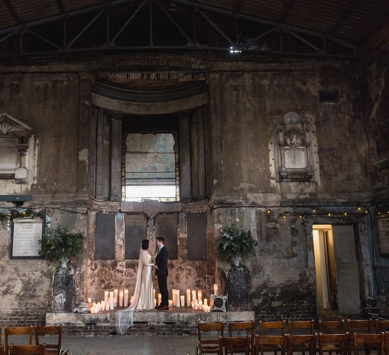 Bride in Story of My Dress Bridal Gown | Groom in Navy Suit from Tom James Tailors | Vintage Wedding at The Asylum & Town hall Hotel London | Kevin Fern Photography